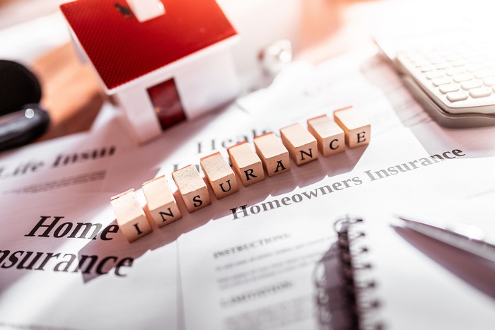 Homeowners Insurance cubes on documents