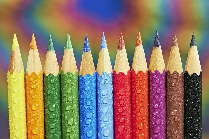 Colored pencils with water drops
