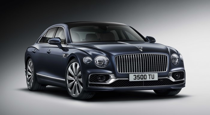 Bentley Flying Spur luxury sedan on gray background