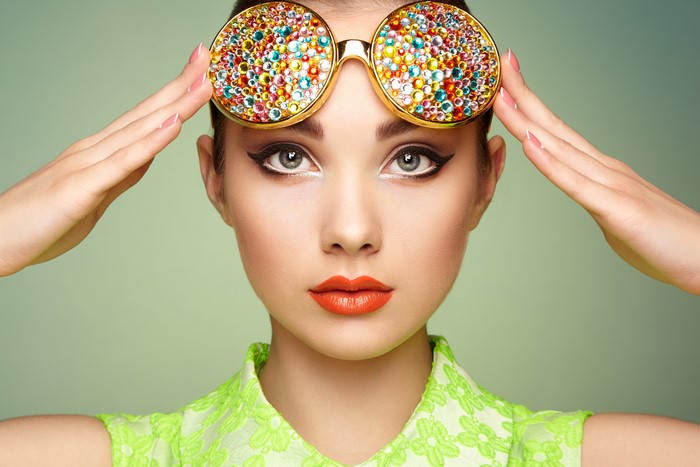 Woman with jeweled glasses and red lips