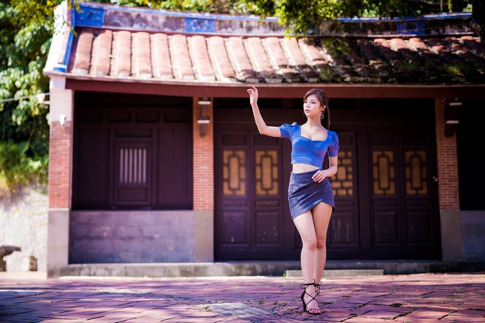 Elegant Asian Woman in Blue Blouse and Skirt 4K