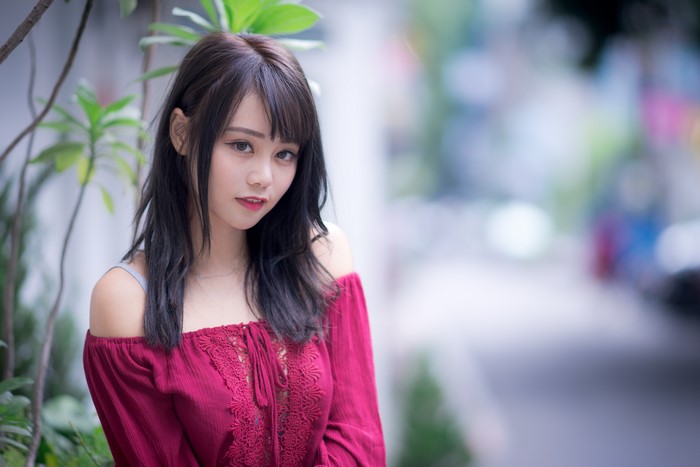4K Portrait of a Brunette Asian Woman in Red Blouse