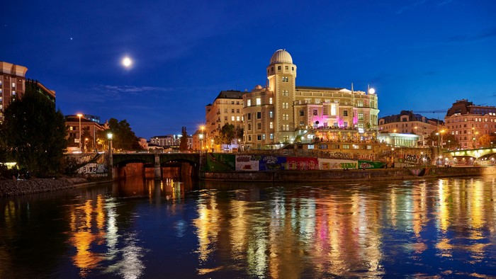 Vienna at night with river and moon