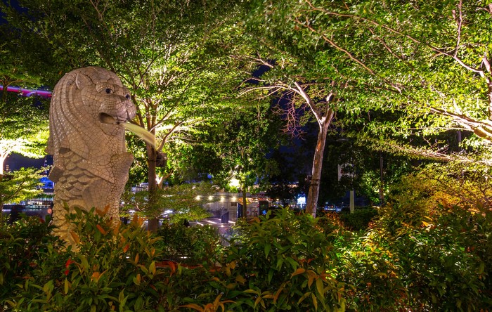 Merlion sculpture in Merlion Park, Singapore at night