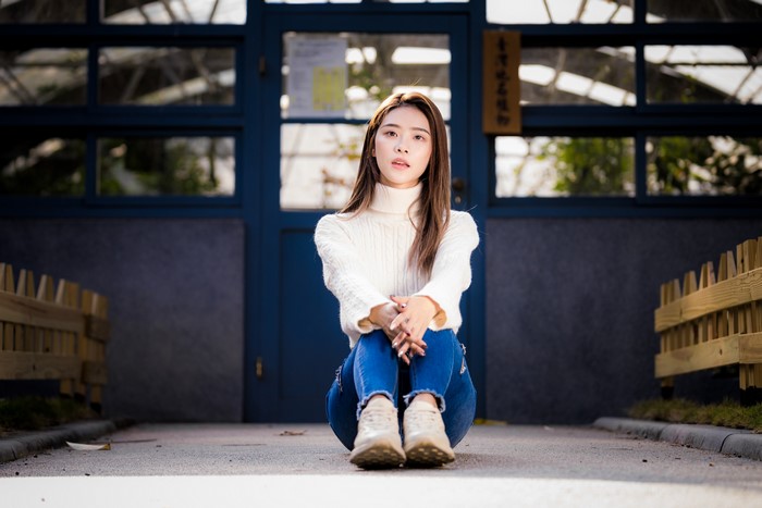 4K Asian Woman Sitting in Sweater and Jeans