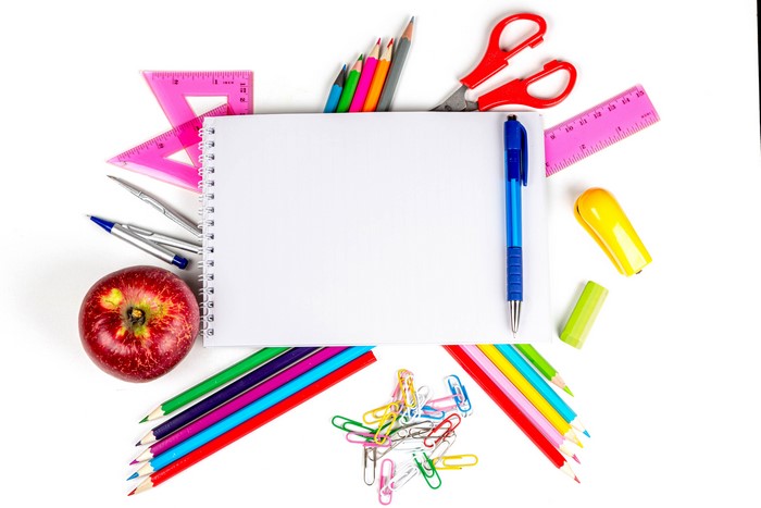 Stationery, Apple, and Notepad on White Background