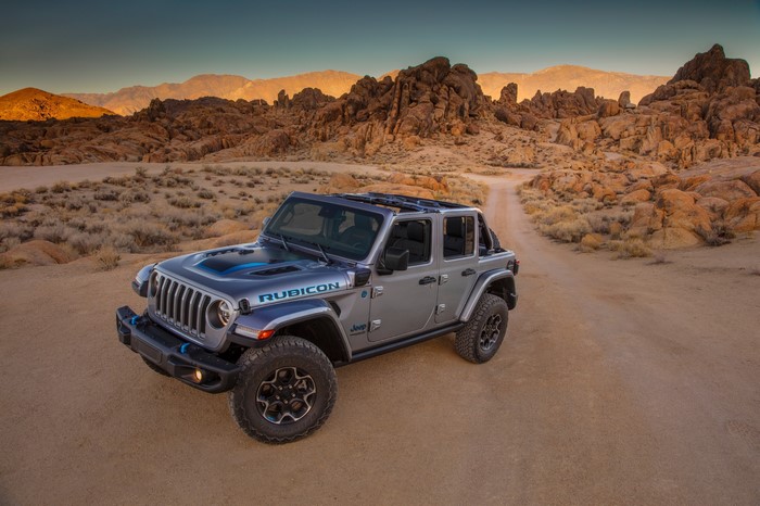 Grey Jeep Wrangler Unlimited Rubicon 4xe in desert landscape