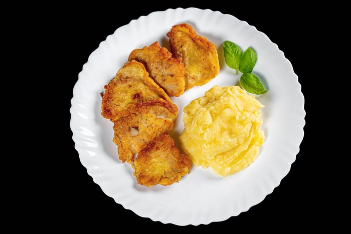 Fried meat with mashed potatoes on a plate