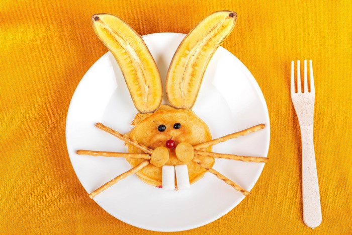Pancake Rabbit with Bananas and Pretzel Whiskers on Plate