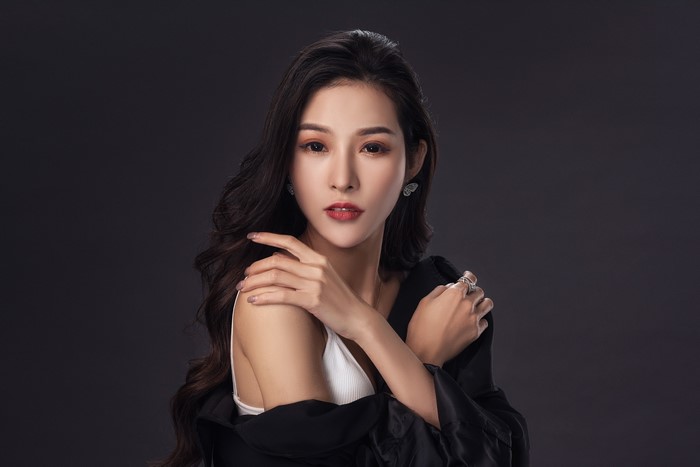 Asian woman with dark hair and makeup