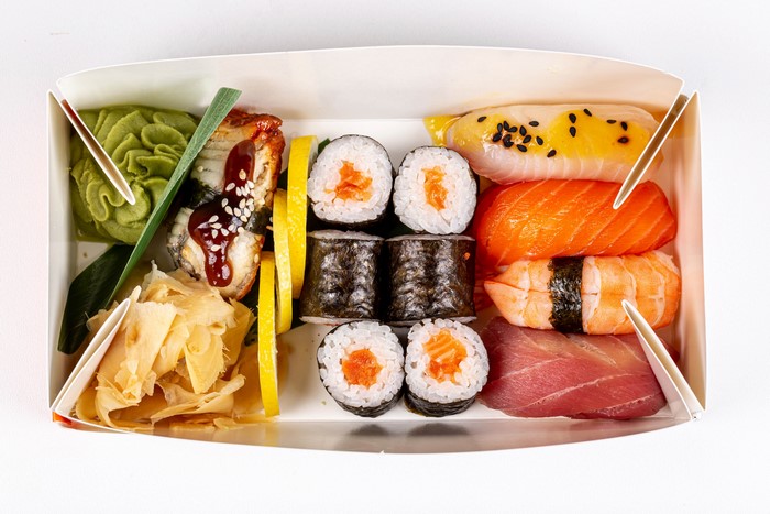 Sushi assortment in a box with wasabi and ginger