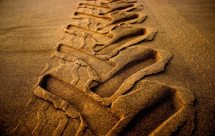 Tire tracks in the sand