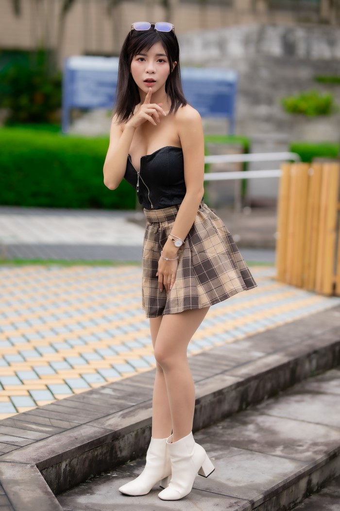 Brunette Asian Woman Posing in Skirt