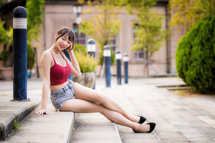 4K Asian Woman Sitting on Stairs in Shorts