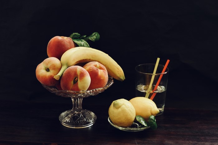 Still life with fruits and a glass of drink