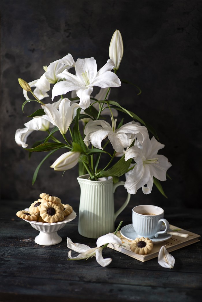 Still life with lilies, cookies, and coffee