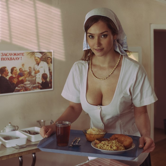Woman in uniform with food tray