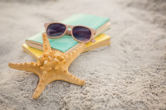 Starfish, Sunglasses, and Books on Sand
