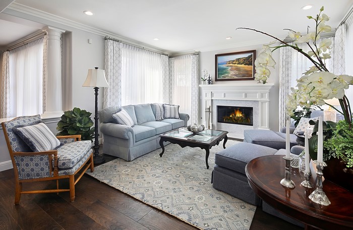 Living room with sofa, armchair, and fireplace