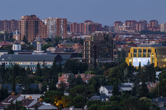 Madrid cityscape with modern buildings and trees