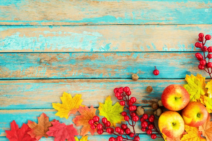 Autumn Apples and Leaves on Wood Planks