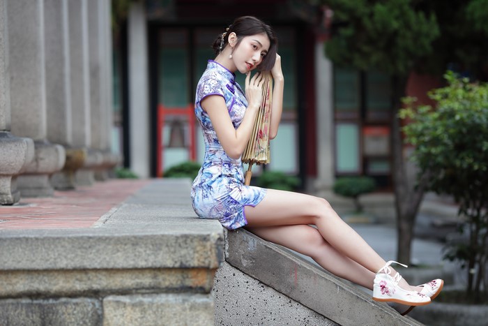 4K Asian Woman Sitting in Elegant Dress