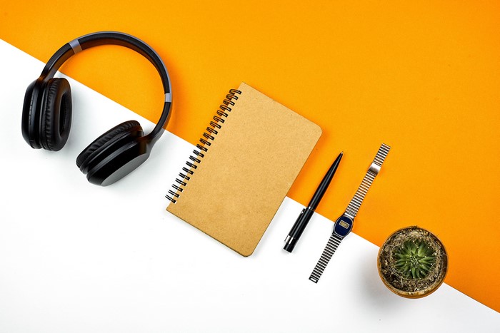 Headphones, Notepad, Pen, Watch, and Cactus