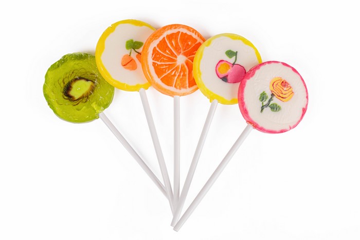 Fruit and Flower Lollipops on White Background
