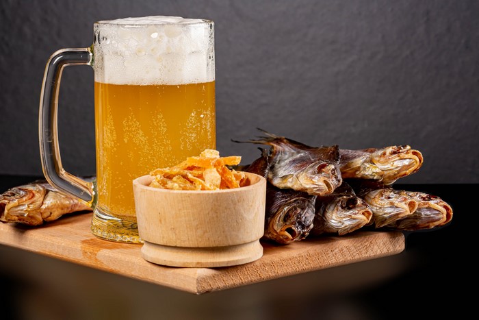 Beer mug with dried fish and snacks