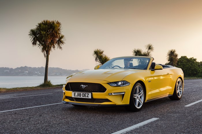 Yellow Ford Mustang GT Convertible on a Coastal Road