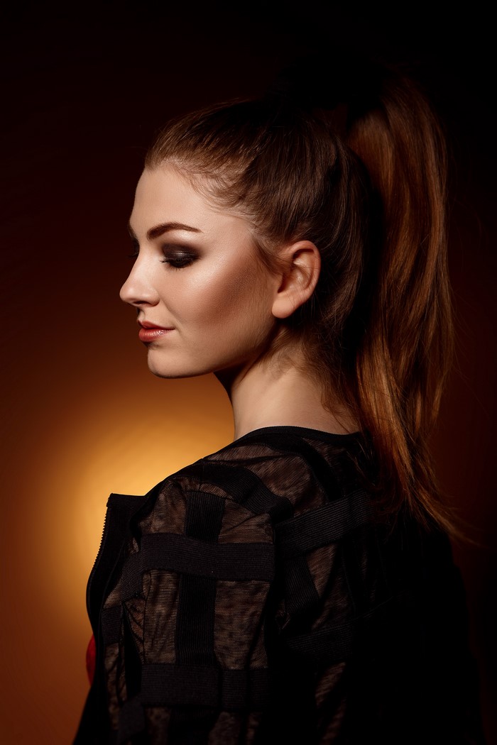 Model with makeup and ponytail