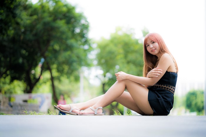 4K Asian Woman Sitting with Smile and Bokeh