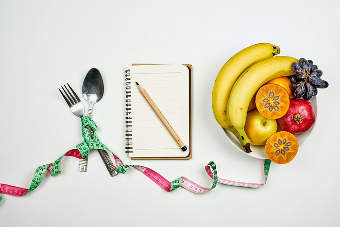 Fruit, Notepad, Utensils, and Measuring Tape