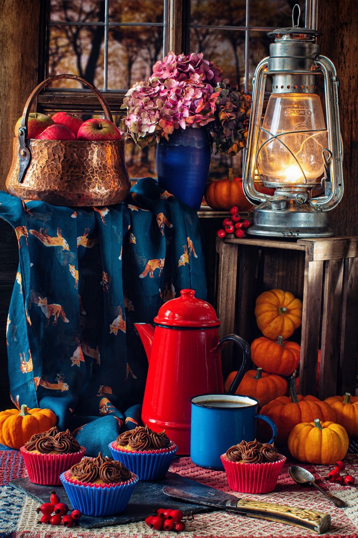 Autumn still life with cupcakes and pumpkins