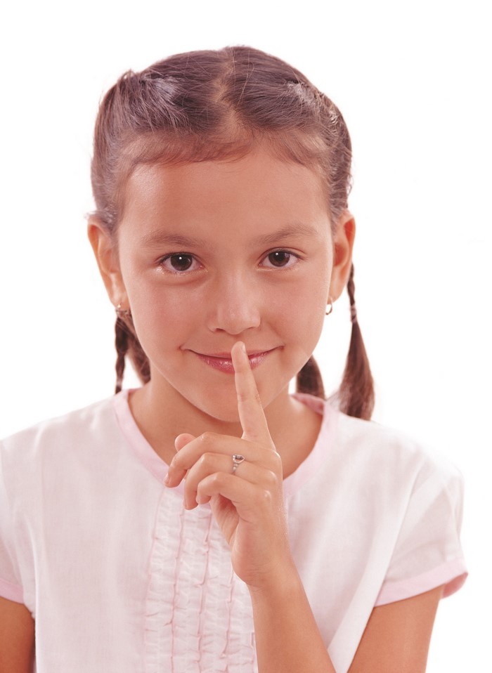 Girl with finger on lips