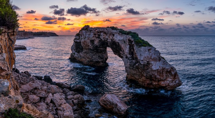 4K Arch rock formation on the coast of Majorca at sunset