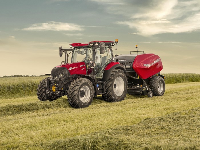 Case IH Versum 130 CVXDrive tractor with baler in field