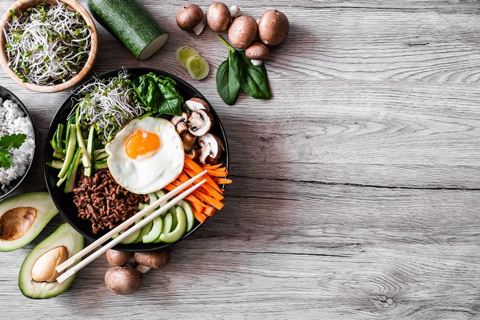 Bibimbap with Fried Egg, Mushrooms, Avocado, and Sprouts