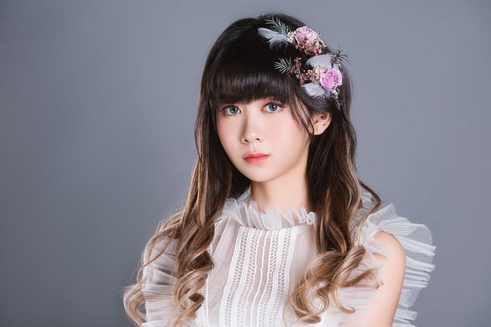 Asian woman with floral hair accessory
