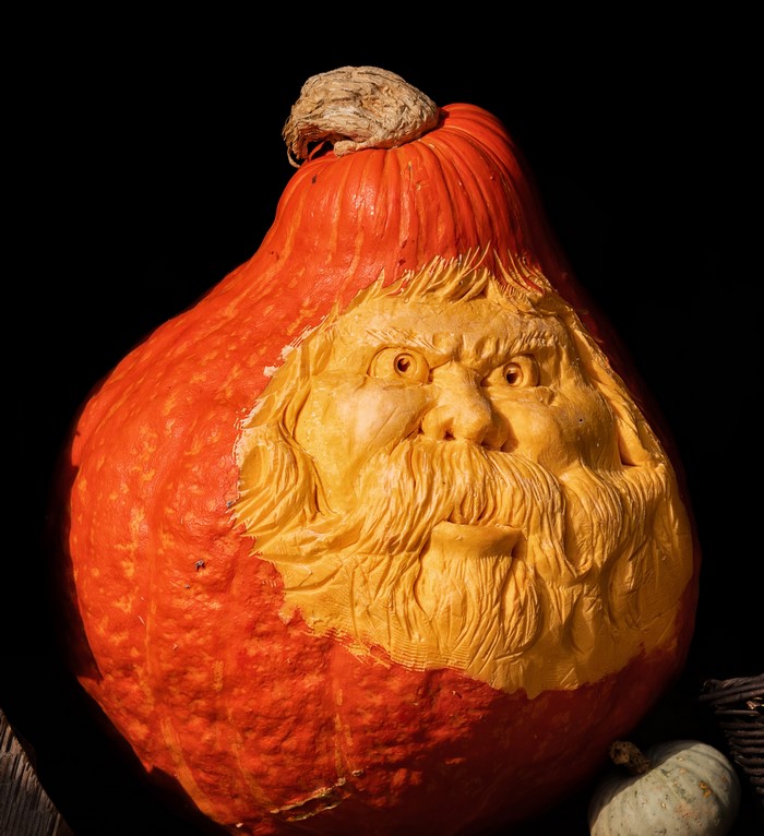 Carved pumpkin with old man face