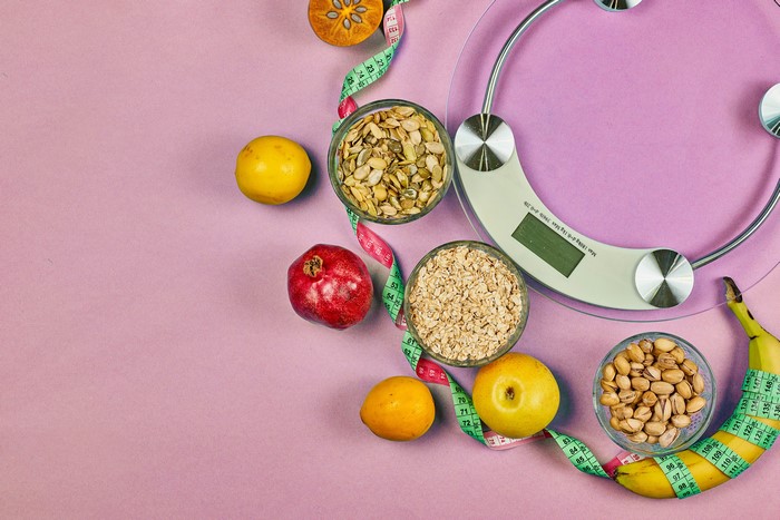 Healthy food and weight scale with tape measure