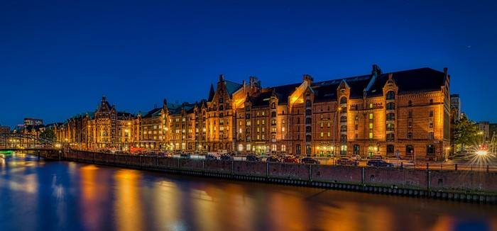 Hamburg Speicherstadt at night with river reflections
