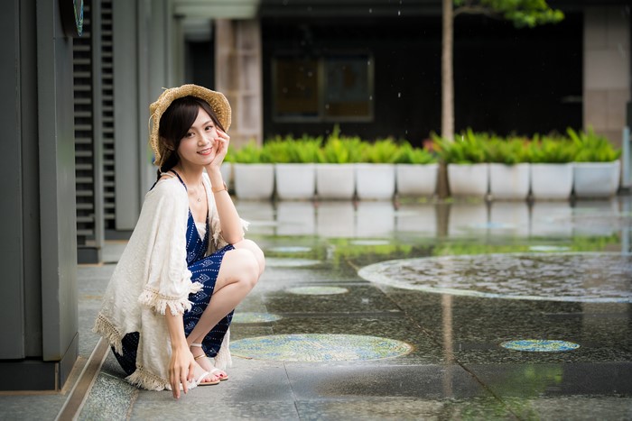 4K Asian Woman Sitting and Smiling with Hat
