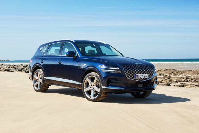 Blue Genesis GV80 3.0D AWD on a beach