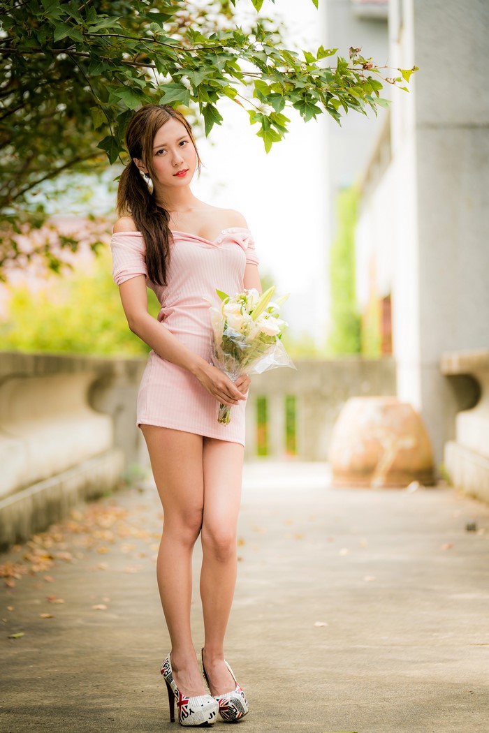 Asian Woman with Bouquets Posing Elegantly