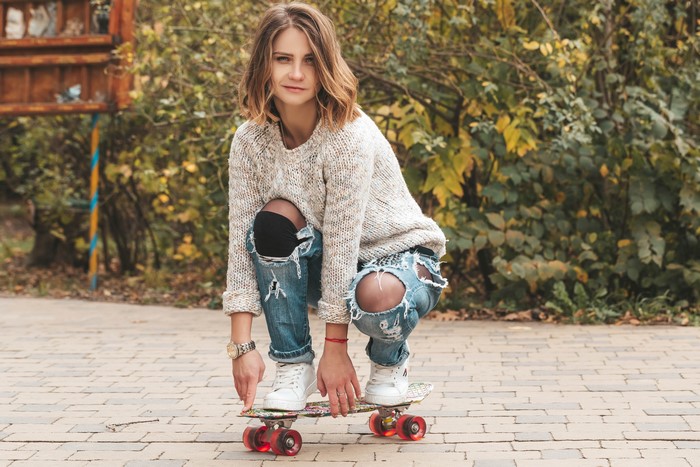 4K Skateboard Girl with Brown Hair and Sweater