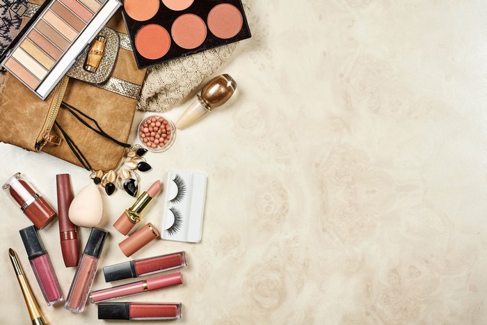 Cosmetics and makeup products arranged on a surface