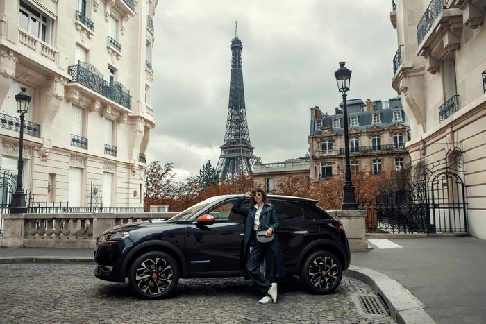 Woman and DS 3 Crossback Crossover in Paris with Eiffel Tower