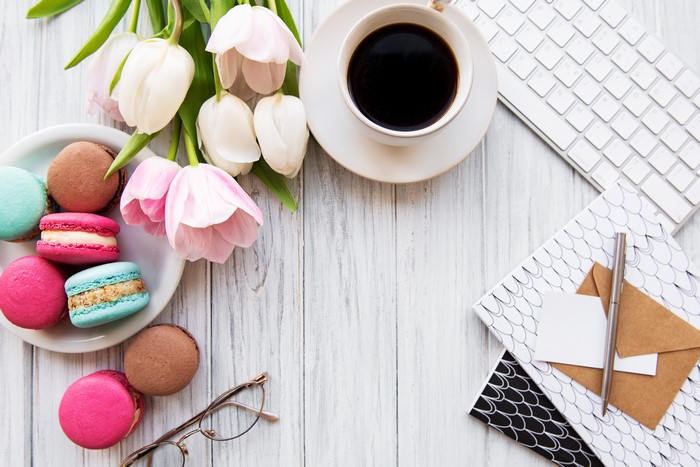 Coffee, Tulips, Macarons, and Stationery on Wood