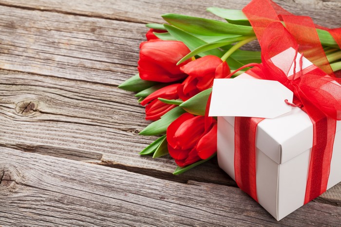 Red Tulips and Gift Box on Wood